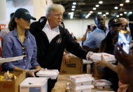 <p>President Donald Trump and first lady Melania Trump help volunteers hand out meals during a visit with flood survivors of Hurricane Harvey at a relief center in Houston, Texas, Sept. 2, 2017. (Photo: Kevin Lamarque/Reuters) </p>