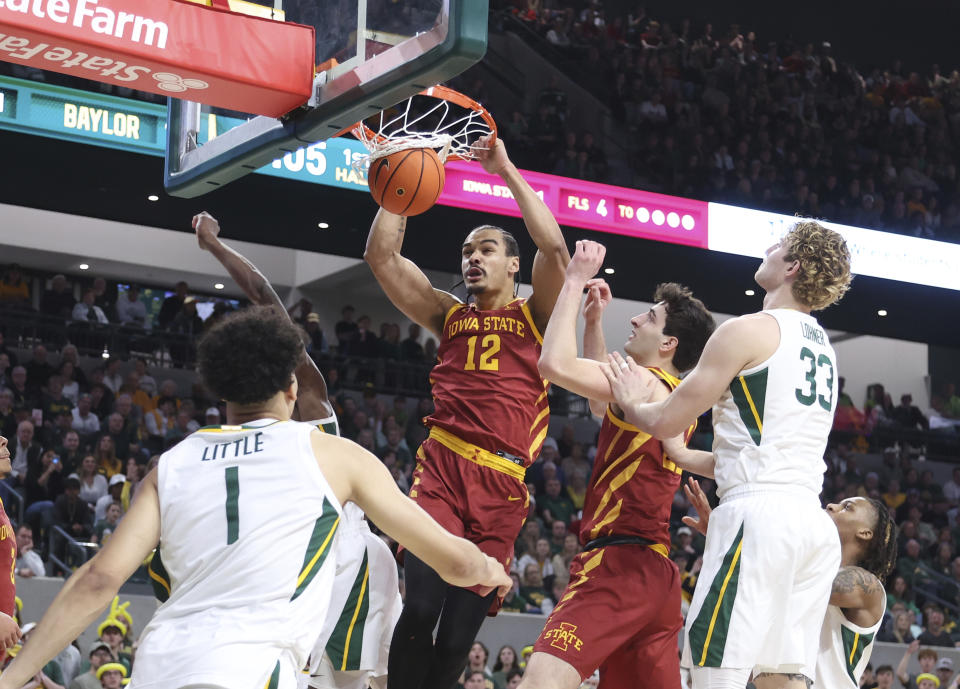 Iowa State forward Robert Jones dunks between Baylor guard Miro Little, left, and Caleb Lohner, right, in the first half of an NCAA college basketball game, Saturday, Feb. 3, 2024, in Waco, Texas. (AP Photo/Rod Aydelotte)