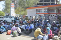 GHAZIABAD, INDIA - MARCH 29: Migrant workers gather at Anand Vihar Bus Terminus as they head to their native state on Day 5 of the 21 day nationwide lockdown imposed by PM Narendra Modi to curb the spread of coronavirus, on March 29, 2020 in Ghaziabad, India. (Photo by Sakib Ali/Hindustan Times via Getty Images)