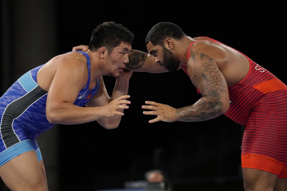 United State's Gable Dan Steveson compete with Mongolia's Lkhagvagerel Munkhtur during the men's 125kg Freestyle wrestling semifinal match at the 2020 Summer Olympics, Thursday, Aug. 5, 2021, in Tokyo, Japan. (AP Photo/Aaron Favila)