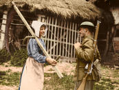 <p>A British soldier talks to a local farm worker, somewhere in Passchendaele, 1917. (Tom Marshall/mediadrumworld.com) </p>