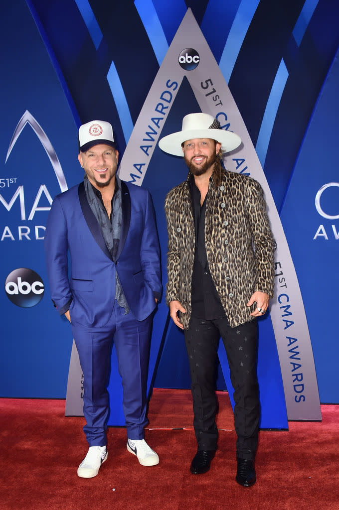 <p>One of the more eccentric pairs of the night, Lucas wore a royal blue suit, while Brust mixed it up with an animal print. (Photo: Getty Images) </p>