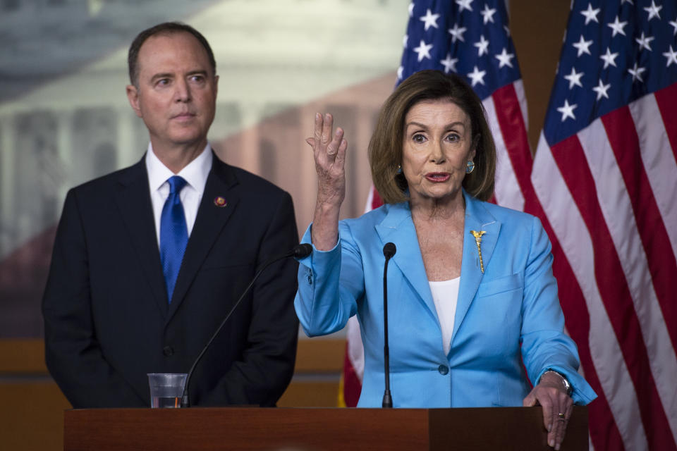 Speaker Pelosi, right, addressed reporters alongside Intelligence Committee Chairman Adam Schiff (D-Calif.). Her support for an impeachment inquiry has largely quieted critics. (Photo: Caroline Brehman/Getty Images)