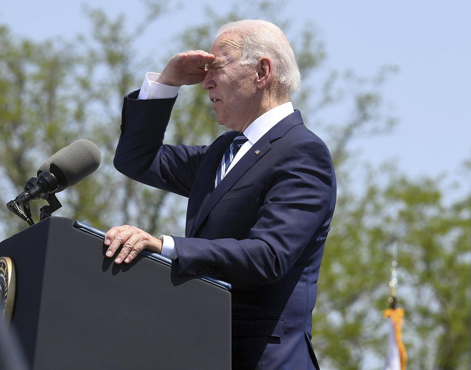 President Joseph R. Biden shades his eyes to survey the the crowd during the 140th commencement exercises for the United States Coast Guard Academy Wednesday, May 19, 2021 in New London, Conn. (Sarah Gordon/The Day via AP)