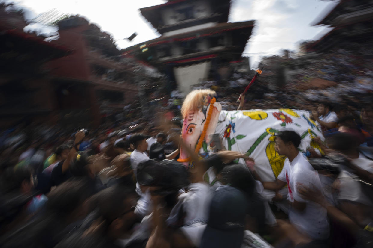 Devotees perform a traditional elephant dance during Indra Jatra, a festival that marks the end of the rainy season in Kathmandu, Nepal, Tuesday, Sept. 17, 2024. (AP Photo/Niranjan Shrestha)