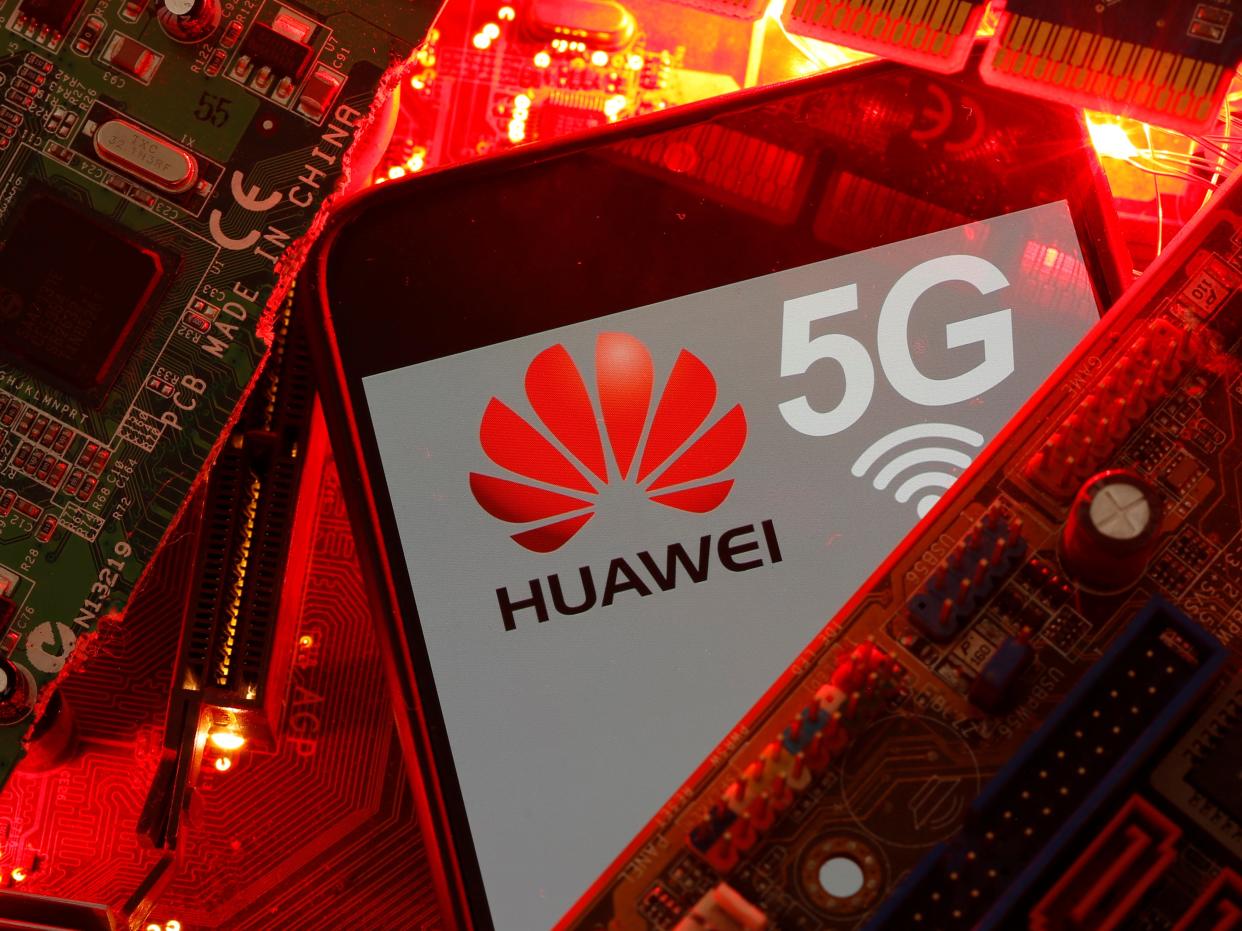 FILE PHOTO: A smartphone with the Huawei and 5G network logo is seen on a PC motherboard in this illustration picture taken January 29, 2020. REUTERS/Dado Ruvic/Illustration