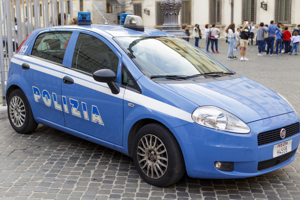 Rome, Italy - October 28, 2019: Blue Italian police car with inscription police (Polizia) in Italian in the Rome City Center