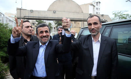 Ex-Iranian President Mahmoud Ahmadinejad gestures as he submits his name for registration as a candidate in Iran's presidential election, in Tehran, Iran April 12, 2017. Tasnim News Agency/Handout via REUTERS