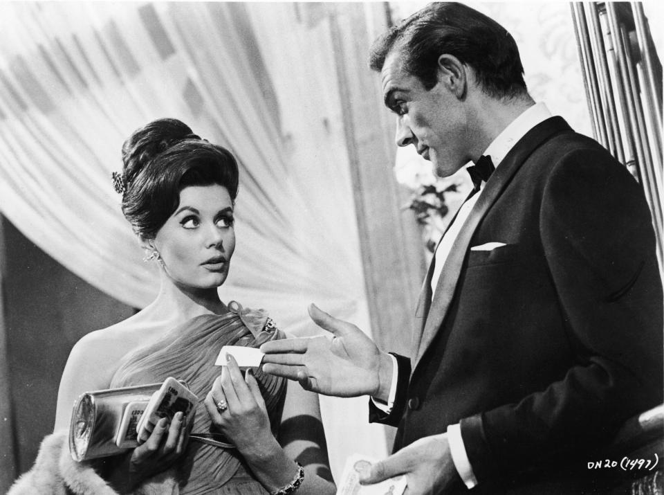 Eunice Gayson and Sean Connery as Sylvia Trench and James Bond, respectively.