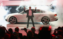 An illusionist performs during the reveal of the Audi RS7