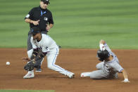 Colorado Rockies' Ezequiel Tovar steals second base as Miami Marlins second baseman Luis Arraez (3) is late with the tag during the fifth inning of a baseball game, Thursday, May 2, 2024, in Miami. (AP Photo/Marta Lavandier)