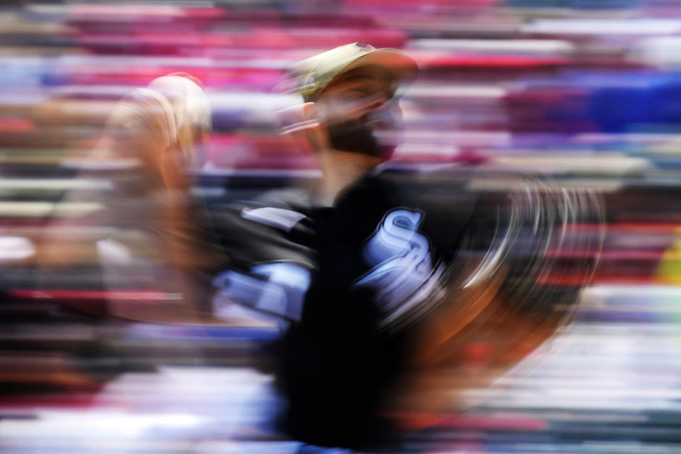 In this image taken with a slow shutter speed, Chicago White Sox starting pitcher Lucas Giolito throws against the Kansas City Royals during the first inning of a baseball game in Chicago, Saturday, May 20, 2023. (AP Photo/Nam Y. Huh)