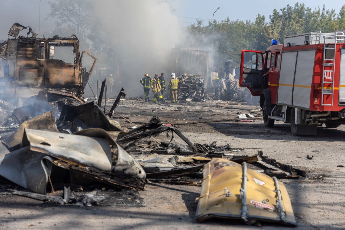 Ukrainian firefighters extinguish a fire following an air attack in the Odesa region this week (AFP via Getty)