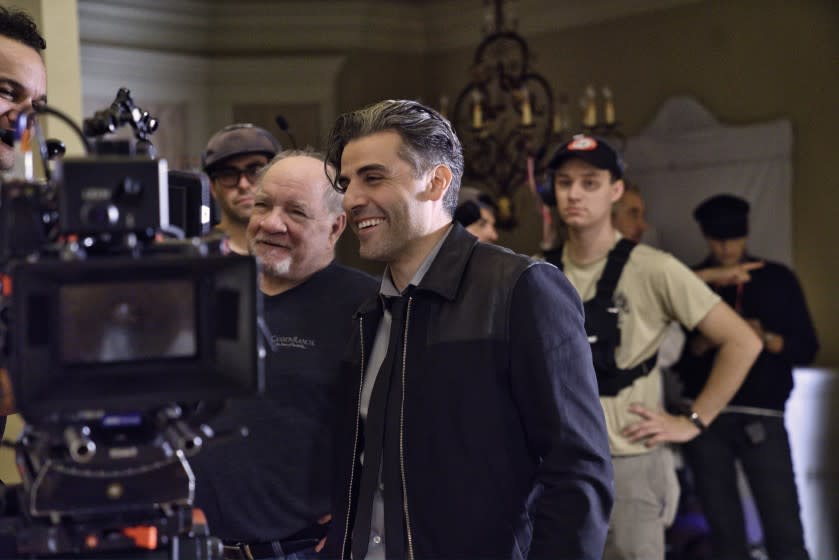 Director Paul Schrader and actor Oscar Isaac on the set of "The Card Counter."