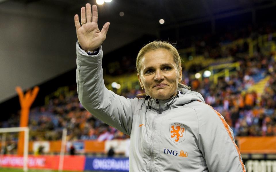 Sarina Wiegman waves to fans during the Netherlands versus Slovenia game in 2019