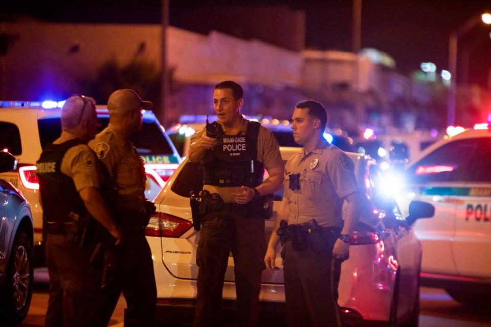 Miami-Dade Police work a crime scene around Northwest 62nd Street and Seventh Avenue in Miami, Florida on Monday, June 15, 2022. A Miami-Dade police officer was shot after a car chase in Liberty City on Monday night, multiple law-enforcement sources said.