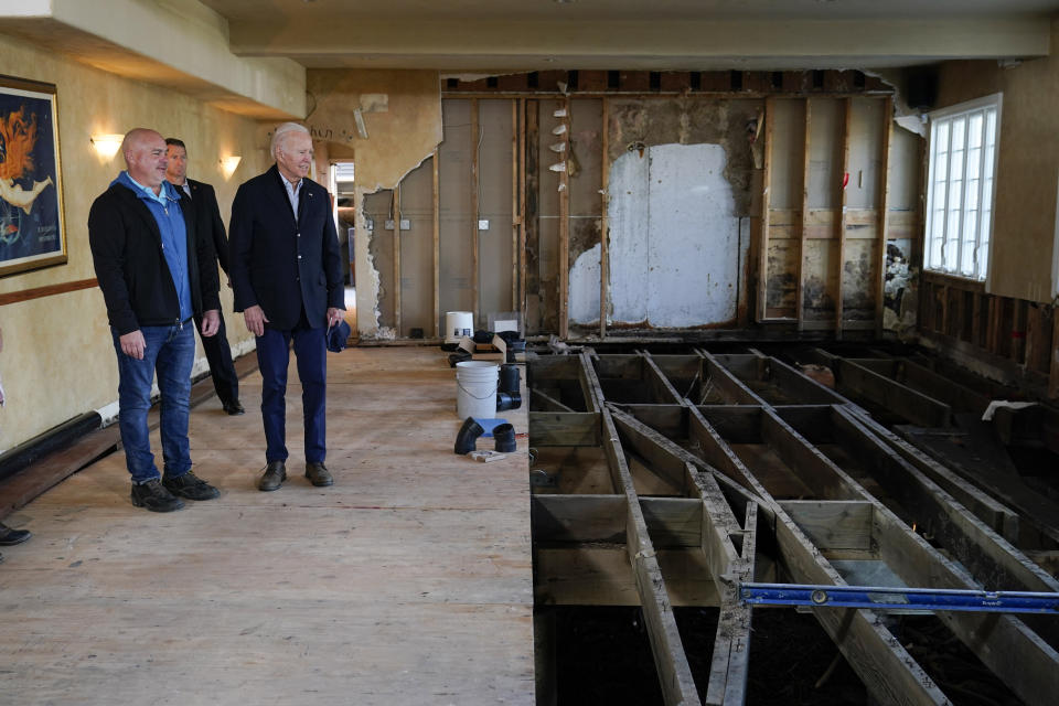 President Joe Biden talks with Paradise Beach Grille co-owner Chuck Maier as he visitswith business owners and local residentsin Capitola,Calif., Thursday, Jan 19, 2023,to survey recovery efforts following a series of severe storms. (AP Photo/Susan Walsh)