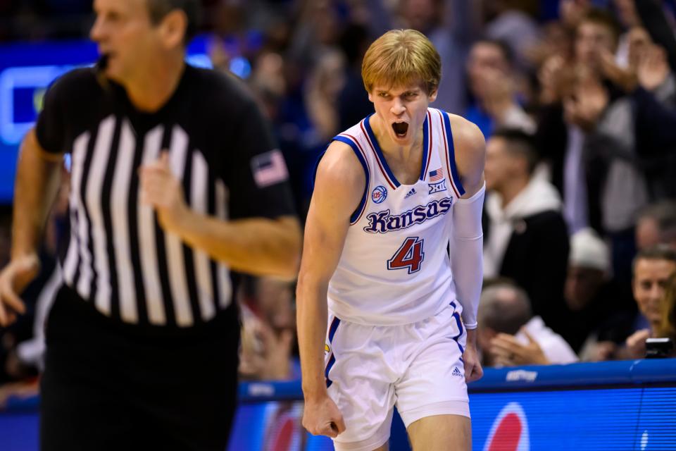 Kansas guard Gradey Dick celebrates a basket against Indiana during the second half of an NCAA college basketball game in Lawrence, Kan., Saturday, Dec. 17, 2022. He led Kansas with 20-points in their 84-62 win. (AP Photo/Reed Hoffmann)