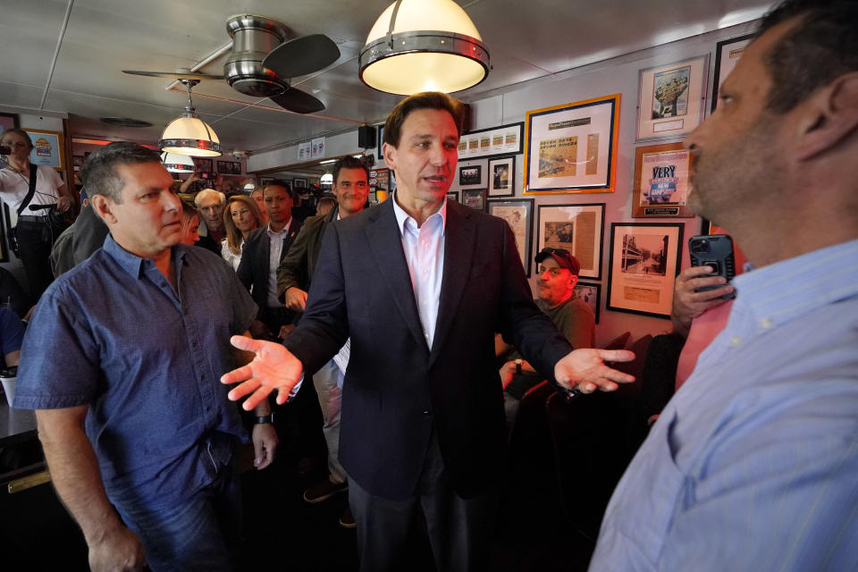 Florida Gov. Ron DeSantis speaks with patrons at the Red Arrow Diner during a visit to Manchester, N.H., Friday, May 19, 2023. (AP Photo/Robert F. Bukaty)