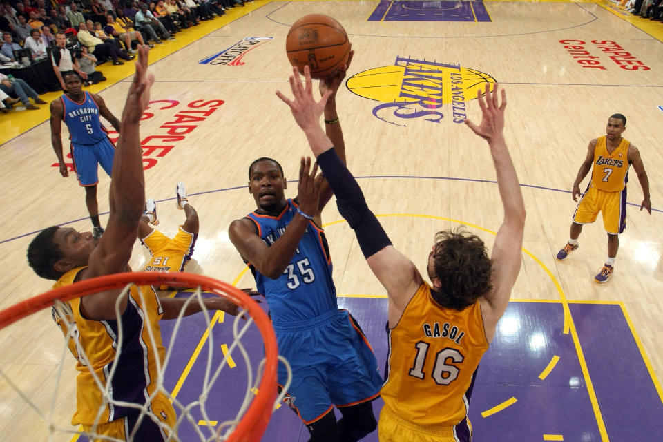 LOS ANGELES, CA - MAY 19: Kevin Durant #35 of the Oklahoma City Thunder goes up for a shot between Andrew Bynum #17 and Pau Gasol #16 of the Los Angeles Lakers in the first half in Game Four of the Western Conference Semifinals in the 2012 NBA Playoffs on May 19 at Staples Center in Los Angeles, California. NOTE TO USER: User expressly acknowledges and agrees that, by downloading and or using this photograph, User is consenting to the terms and conditions of the Getty Images License Agreement. (Photo by Stephen Dunn/Getty Images)