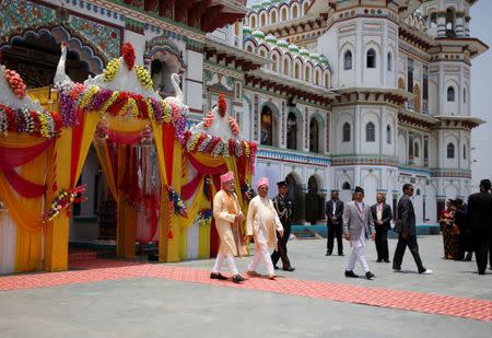 India's Prime Minister Narendra Modi along with his Nepalese counterpart Khadga Prasad Sharma Oli, also known as K.P. Oli, walks out from the Janaki Mandir, a Hindu temple dedicated to goddess Sita, in Janakpur, Nepal May 11, 2018. REUTERS/Navesh Chitrakar