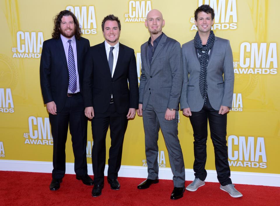 NASHVILLE, TN - NOVEMBER 01: (L-R) James Young, Mike Eli, Jon Jones, and Chris Thompson of Eli Young Band attend the 46th annual CMA Awards at the Bridgestone Arena on November 1, 2012 in Nashville, Tennessee. (Photo by Jason Kempin/Getty Images)