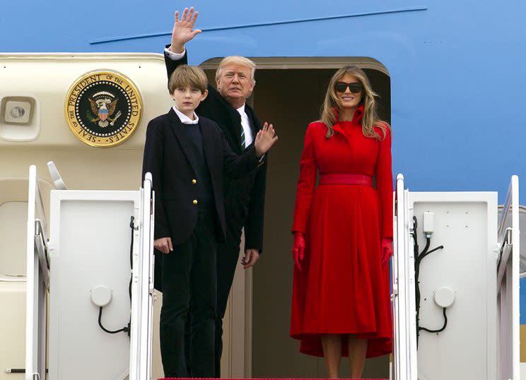 President Donald Trump, accompanied by first lady Melania Trump, and their son Barron. (Photo: AP Photo/Jose Luis Magana)
