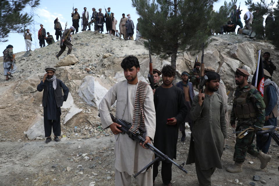 Afghan militiamen join Afghan defense and security forces during a gathering in Kabul, Afghanistan, Wednesday, June 23, 2021. Taliban gains in north Afghanistan, the traditional stronghold of the country's minority ethnic groups who drove the insurgent force from power nearly 20 years ago, has driven a worried government to resurrect militias whose histories have been characterized by chaos and widespread killing. (AP Photo/Rahmat Gul)