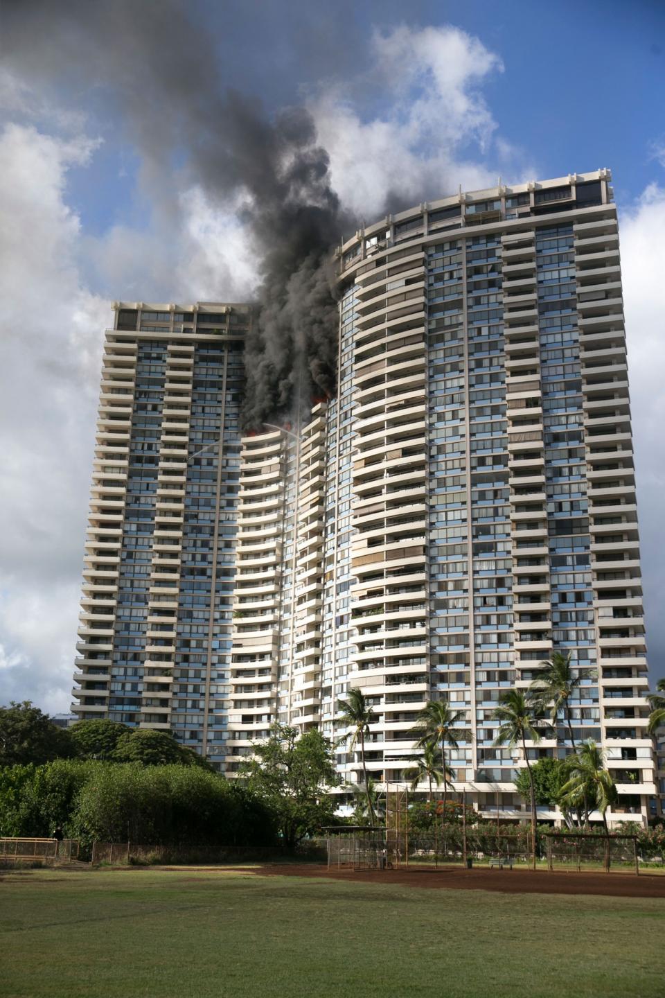 Smoke billows from the upper floors