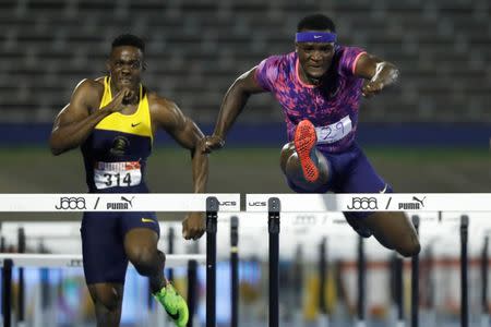 Athletics - JAAA National Senior Championships - Men's 110m hurdles final - National Stadium Kingston, Jamaica - June 24, 2017 Jamaica's Omar McLeod (R) and Ronald Levy in action. REUTERS/Lucy Nicholson