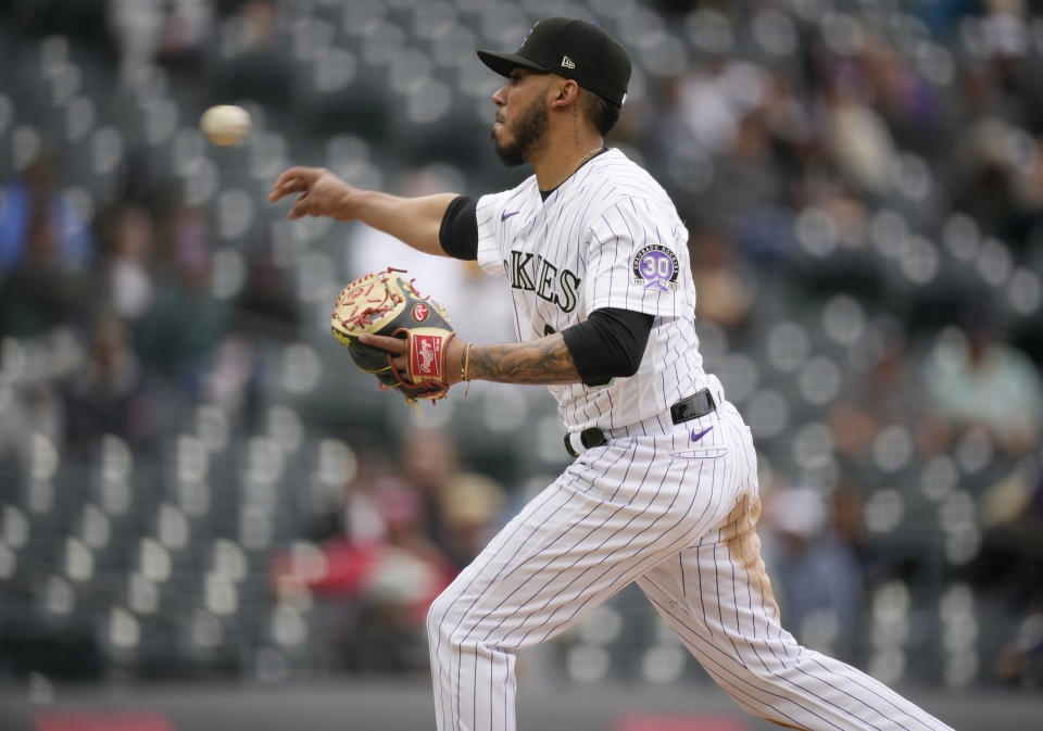 Colorado Rockies outfielder Harold Castro works as a relief pitcher in the ninth inning of a baseball game against the Pittsburgh Pirates Wednesday, April 19, 2023, in Denver. (AP Photo/David Zalubowski)