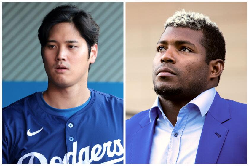 Dodgers Shohei Ohtani walks back into he dugout after striking out against the Angels in the first inning at Angels Stadium on Tuesday March 26, 2024. Right, former Dodgers outfielder Yasiel Puig, right, and his agent Lisette Carnet, left, at a news conference outside the federal courthouse in downtown Los Angeles on Saturday February 11, 2023 in Los Angeles, CA. (Wally Skalij/Los Angeles Times, Brian van der Brug / Los Angeles Times)