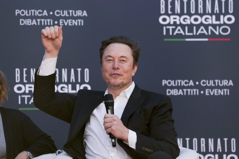 Tesla and SpaceX's CEO Elon Musk cheers as he speaks at the annual political festival Atreju, organized by the Giorgia Meloni's Brothers of Italy political party, in Rome, Saturday, Dec. 16, 2023. (AP Photo/Alessandra Tarantino)