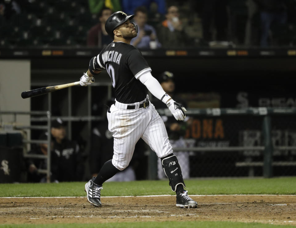 Chicago White Sox's Yoan Moncada watches his RBI sacrifice fly during the eighth inning of the team's baseball game against the Baltimore Orioles on Tuesday, May 22, 2018, in Chicago. (AP Photo/Charles Rex Arbogast)