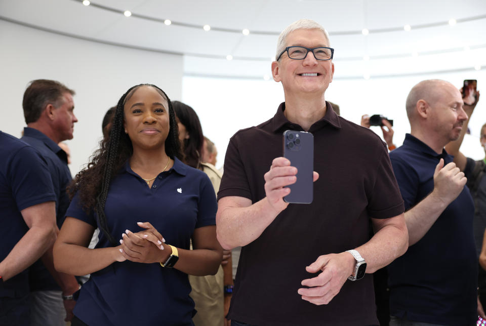 The iPhone 14 debuted at Apple's fall conference, with CEO Cook holding the iPhone 14 Pro. Photo credit: Justin Sullivan/Getty Images