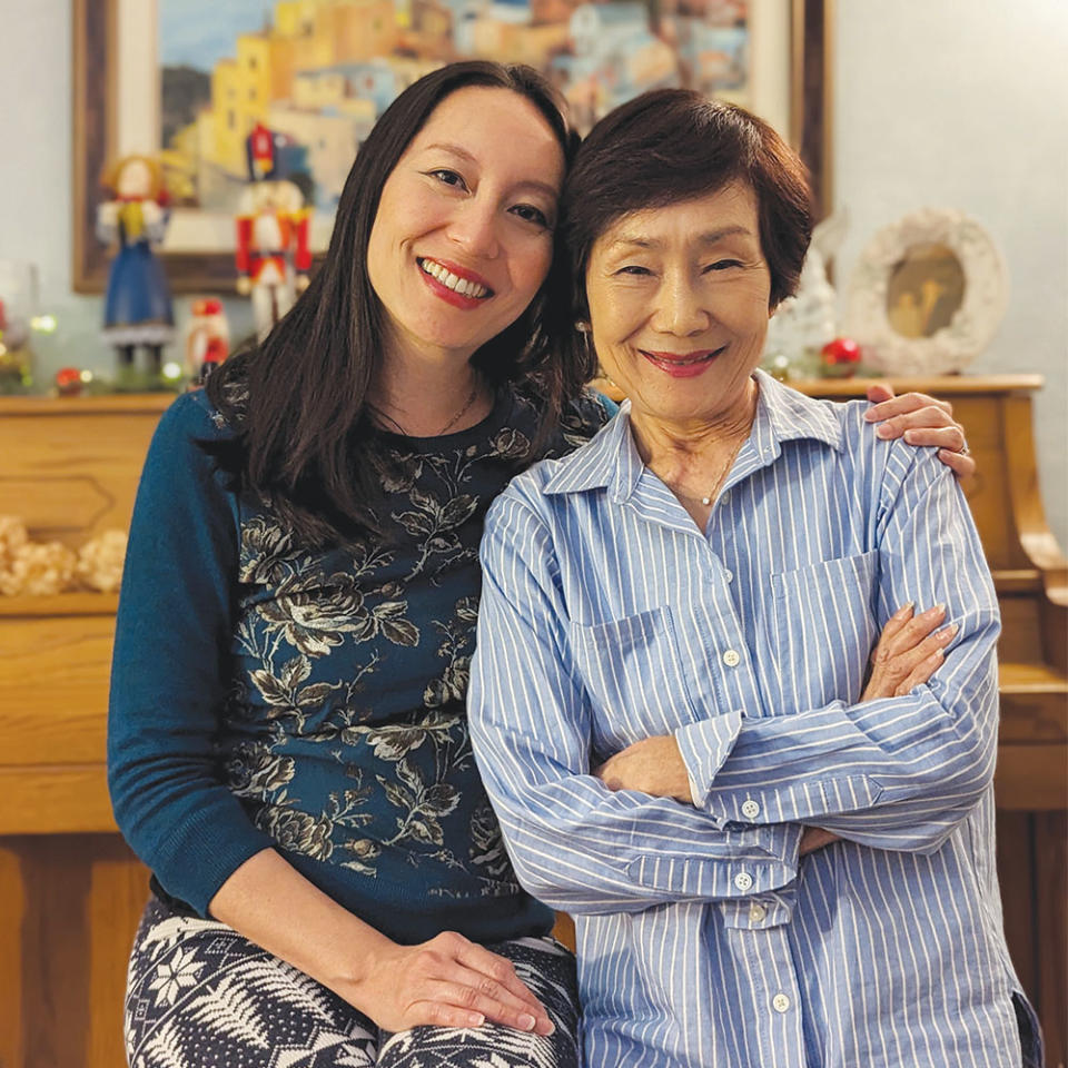 THR’s Rebecca Sun (left) with her mother, Julie Sun, at home on Dec. 25, 2022.
