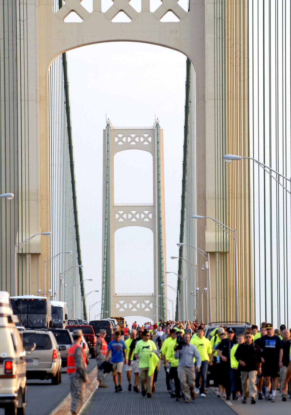 Michigan Gov. Rick Snyder leads the annual Labor Day Mackinac Bridge Walk, Monday, Sept. 3, 2012, across the five-mile span that connect Michigan's upper and lower peninsulas. (AP Photo/John L. Russell)