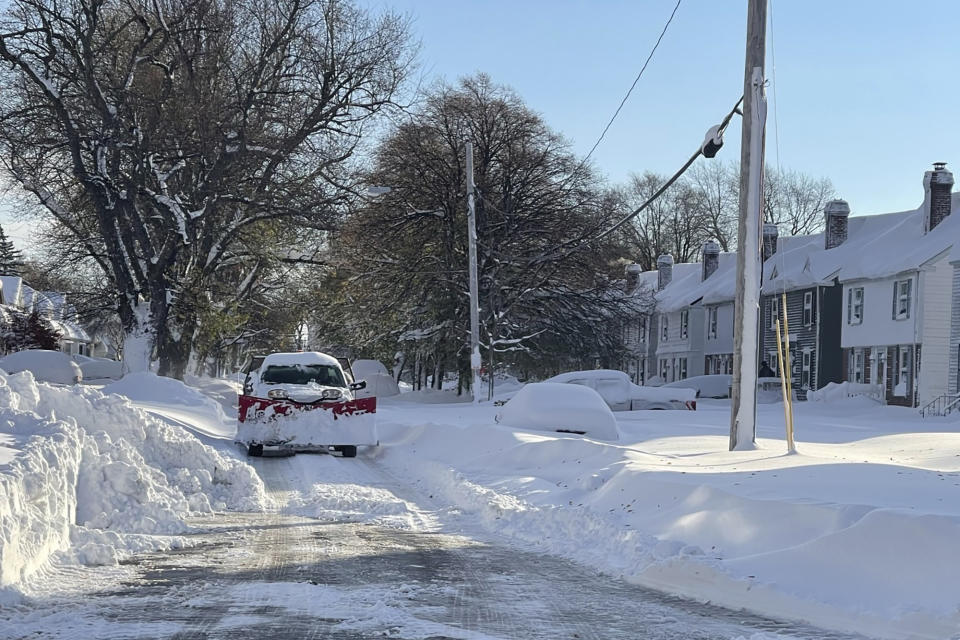 Snow covers the ground in Buffalo, N.Y. on Saturday, Nov. 19, 2022. Residents of northern New York state are digging out from a dangerous lake-effect snowstorm that had dropped nearly 6 feet of snow in some areas and caused three deaths. The Buffalo metro area was hit hard, with some areas south of the city receiving more than 5 feet by early Saturday. (AP Photo/Carolyn Thompson)