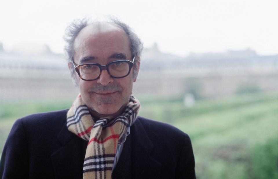 Jean-Luc Godard with a scarf on