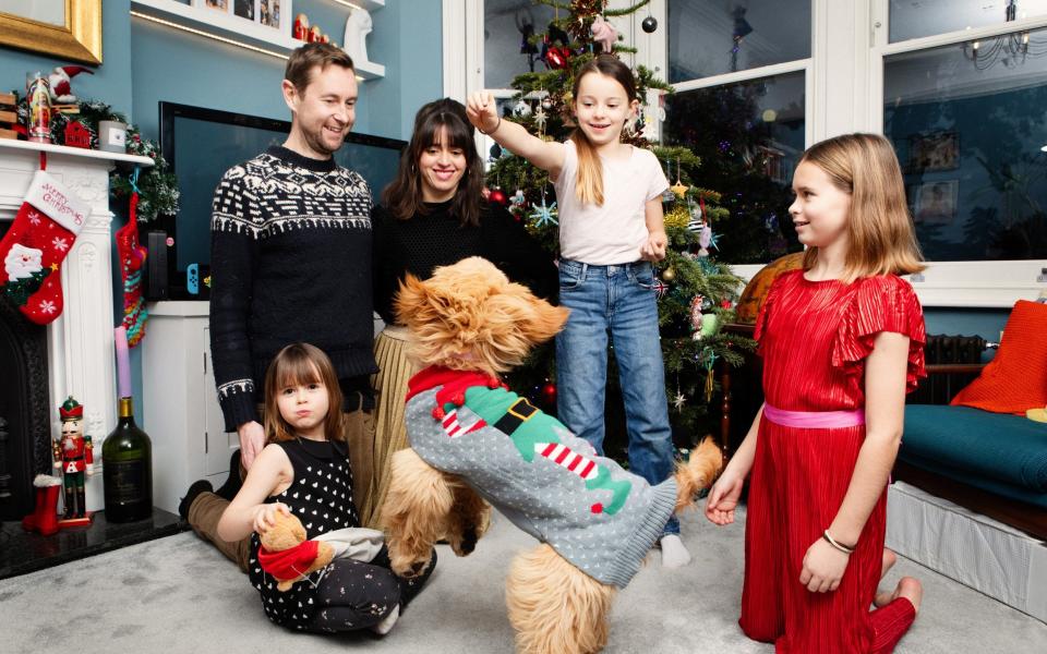 Fiona Cowood with James Ross and their children Daphne, 11, Olive, 8, and Daisy, 5 with their goldendoodle Calli