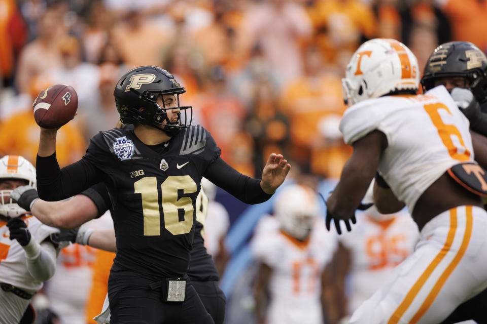 NASHVILLE, TN - DECEMBER 30:  Aidan O'Connell #16 of the Purdue Boilermakers passes the ball against the Tennessee Volunteers during the first quarter of the TransPerfect Music City Bowl at Nissan Stadium on December 30, 2021 in Nashville, Tennessee. (Photo by Brett Carlsen/Getty Images)