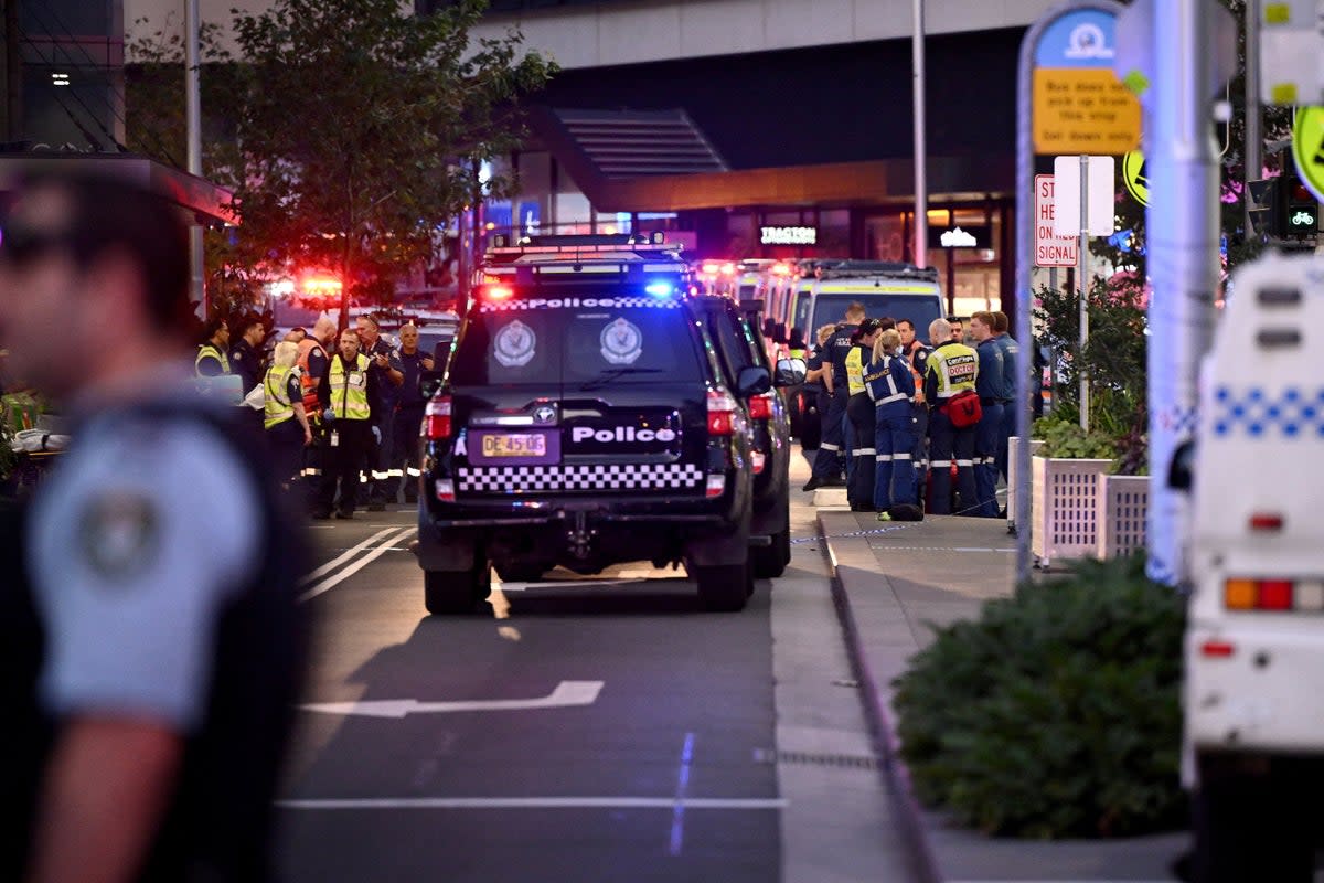 Emergency service workers are seen at the scene at Bondi Junction (via REUTERS)