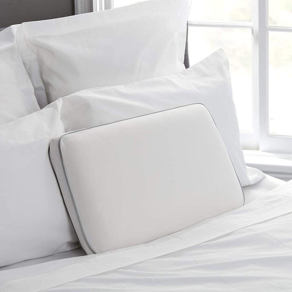 sealy pillow on bed with other white pillows