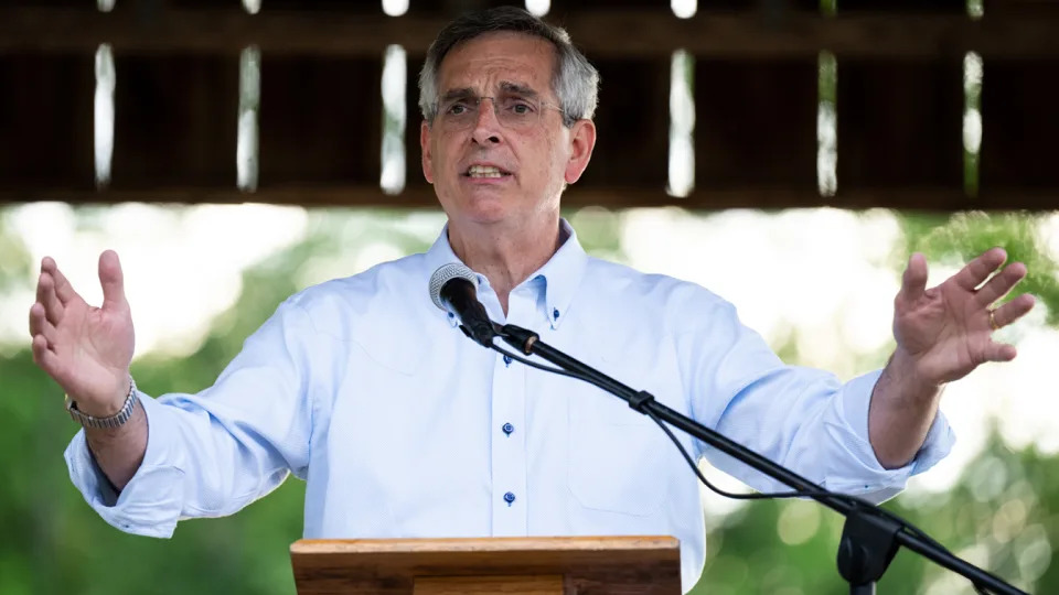 Georgia Secretary of State Brad Raffensperger speaks at a podium.