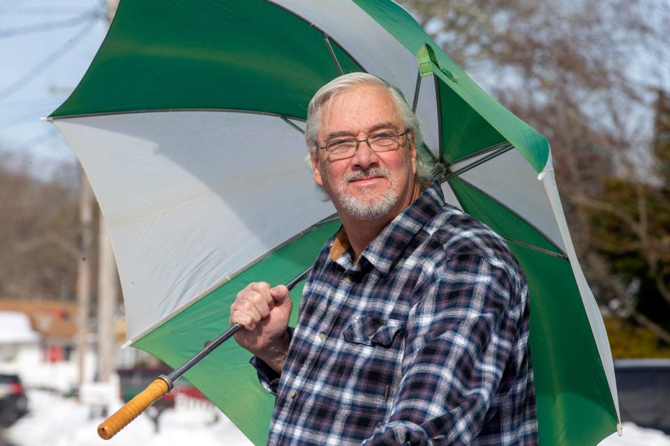 Bob Burger of Point Pleasant Borough and a retired police chief who runs a widely followed Facebook page where he posts weather forecasts, stands outside of his home in Point Pleasant Borough, NJ Tuesday, February 2, 2022. 