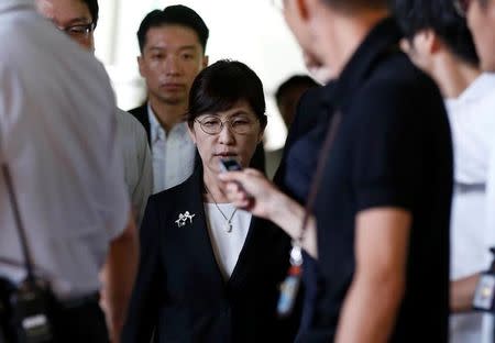 Japan's Defense Minister Tomomi Inada (C) is surrounded by reporters as she leaves Prime Minister Shinzo Abe's official residence in Tokyo, Japan July 28, 2017. REUTERS/Toru Hanai