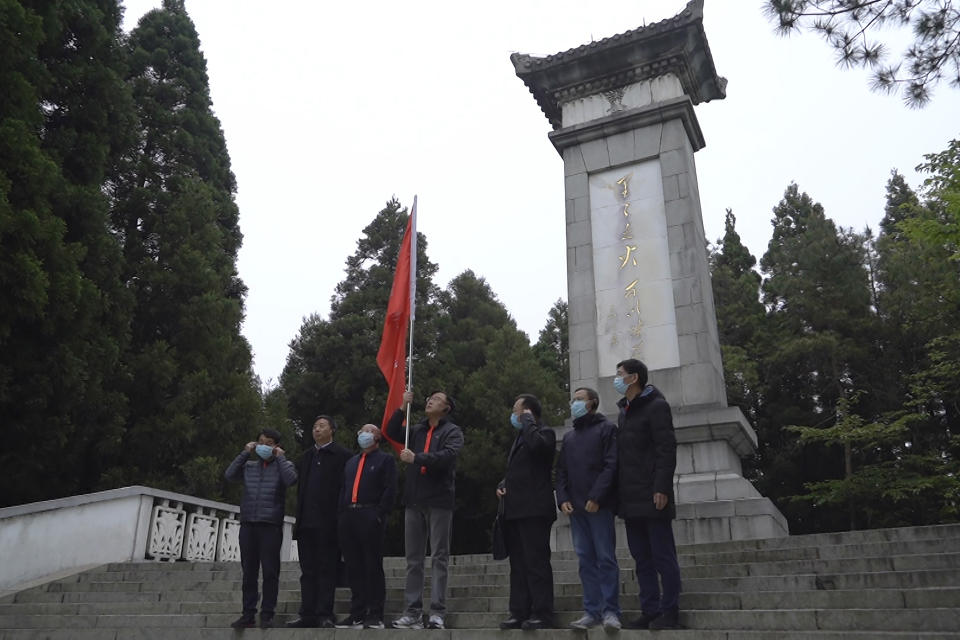 Students at the China Executive Leadership Academy take group photos in front of a revolutionary war memorial in JInggangshan in southeastern China's Jiangxi Province, on April 9, 2021. As China celebrates the 100th anniversary of its 1921 founding, such trainings are part of efforts by President Xi Jinping's government to extend party control over a changing society. (AP Photo/Emily Wang)