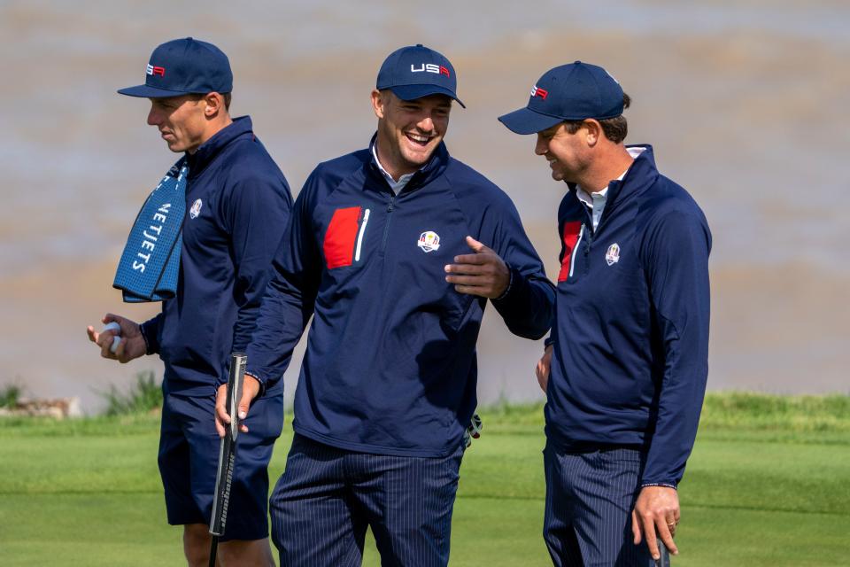 Team USA player Bryson DeChambeau (center) talks to player Harris English (right) on the 17th hole during a practice round for the 43rd Ryder Cup at Whistling Straits.