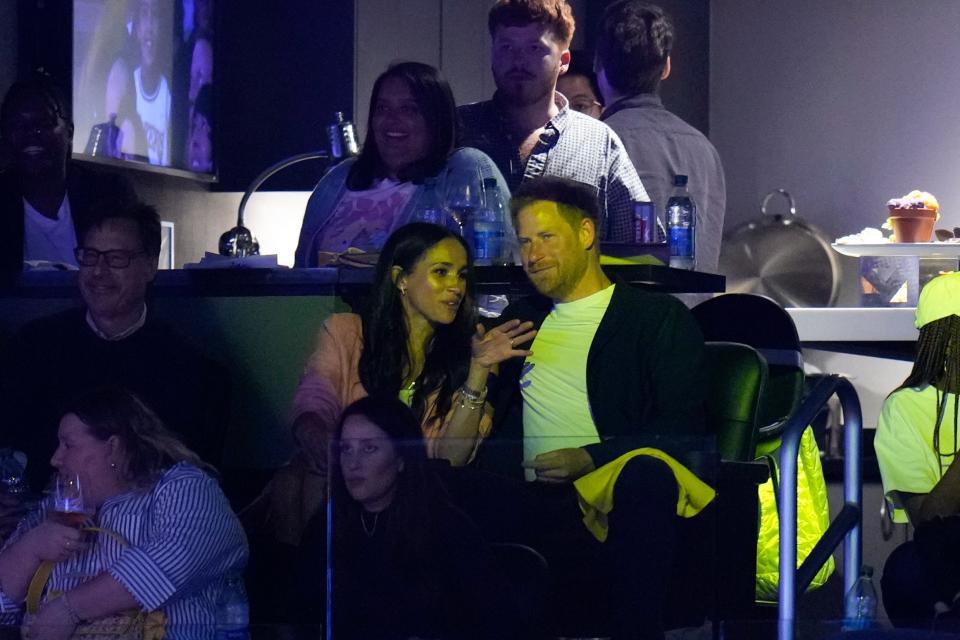 Prince Harry and Meghan, the Duchess of Sussex attend the Los Angeles Lakers' Game 4 of a first-round NBA basketball playoff series against the Memphis Grizzlies on April 24 in Los Angeles.