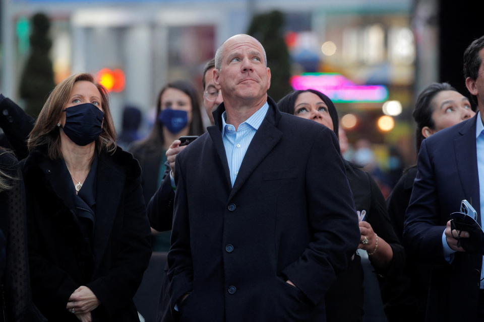 Jon Winkelried, CEO of private-equity firm TPG, celebrates his company's IPO outside the Nasdaq Market site in New York City, January 13, 2022. REUTERS/Brendan McDermid